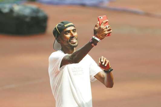  Great Britainu2019s Mo Farah takes a selfie at the London stadium yesterday. (Reuters)