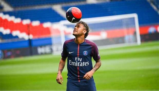 Neymar plays with a ball during his official presentation at the Parc des Princes stadium in Paris on Friday.