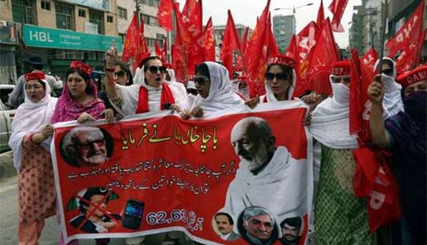 Supporters of Awami National Party attend a protest rally in support of lawmaker Ayesha Gulalai in Peshawar on Friday.