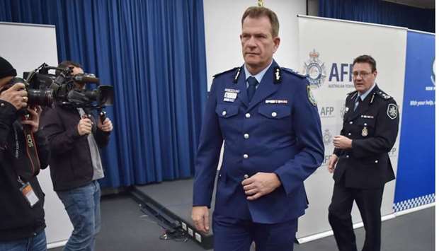 Australian Federal Police Deputy Commissioner Michael Phelan (R) and New South Wales Police Deputy Commissioner David Hudson leave a press conference after addressing the media in Sydney.