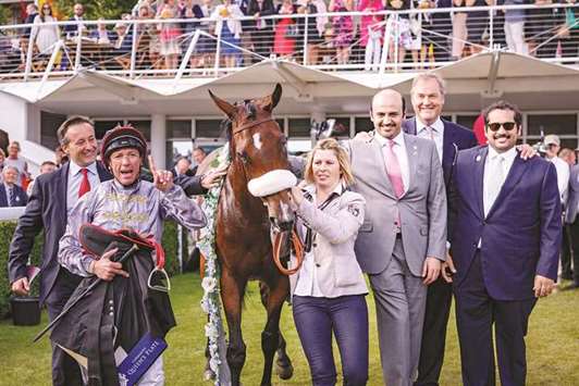 Al Shaqab Racingu2019s executive director Khalifa bin Mohamed al-Attiyah (third from right), racing manager Harry Herbert (second from right), and Qatar Racing and Equestrian Club (QREC) general manager Nasser Sherida al-Kaabi (right) lead in Al Jazi, who was ridden to victory in the  Lu2019Ormarins Queens Plate Oak Tree Stakes by Frankie Dettori (second from left), at Qatar Goodwood Festival yesterday. PICTURE: Juhaim