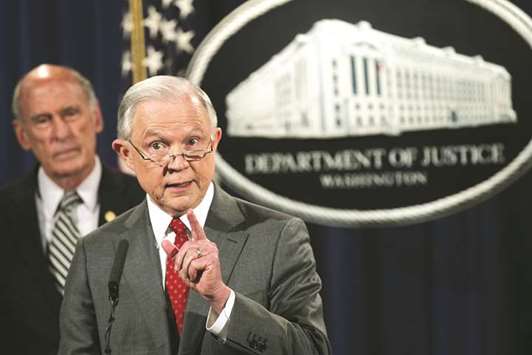 Sessions speaks during the news conference at the Justice Department in Washington, DC. Also seen is Director of National Intelligence Dan Coats.
