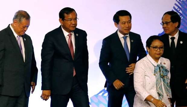(L-R) Brunei's Second Minister of Foreign Affairs and Trade Lim Jock Seng, Cambodia's Foreign Minister Prak Sokhon, Laos' Foreign Minister Saleumxay Kommasith, Indonesia's Foreign Minister Retno Marsudi, and ASEAN Secretary-General Le Luong Minh attend a meeting of the 50th Association of Southeast Asia Nations (ASEAN) Regional Forum (ARF) in Manila.