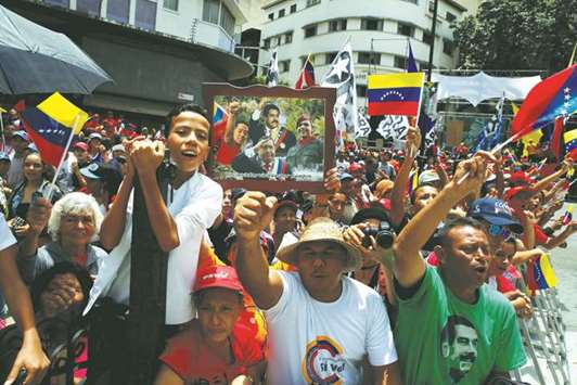 Supporters of Venezuelau2019s President Nicolas Maduro demonstrate outside Legislative Palace during the National Constituent Assemblyu2019s first session, in Caracas yesterday.