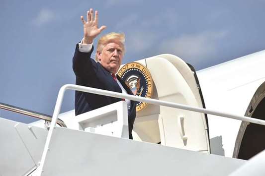 Trump boards Air Force One at Andrews Air Force Base in Maryland as he travels on a 17-day vacation to his golf resort in Bedminster, New Jersey.