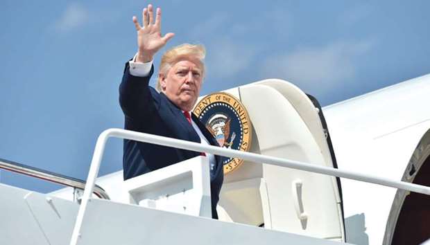 Trump boards Air Force One at Andrews Air Force Base in Maryland as he travels on a 17-day vacation to his golf resort in Bedminster, New Jersey.