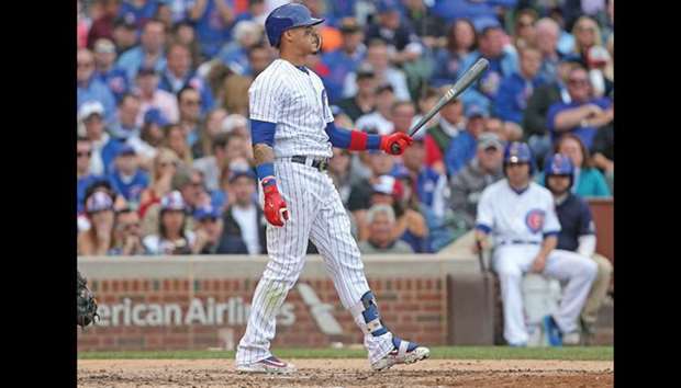 Chicago Cubs shortstop Javier Baez (9) reacts to striking out during the ninth inning against the Washington Nationals at Wrigley Field.