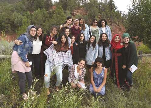 Palestinian and Israeli Jewish girls pose for a group photo at the Creativity for Peace camp in Santa Fe, New Mexico.