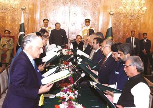 Federal ministers of Pakistanu2019s new cabinet being sworn in by Pakistani President Mamnoon Hussain during a ceremony at President House in Islamabad on Friday.
