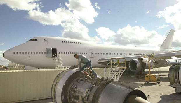 A Boeing 747 is prepared to go back into service after being stored at the Evergreen Air Center in Marana, Arizona. The Boeing pact sets the stage for a modernised Air Force One programme after President Donald Trump criticised its cost, threatened to cancel the order and later boasted of negotiating with Boeing to reduce the expense.