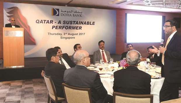 Seetharaman looks on while participants of the financial institutions event engage in a discussion.