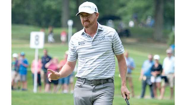 Jimmy Walker acknowledges the crowd after making his putt on the eighth hole during the second round of the WGC-Bridgestone Invitational golf tournament in Akron, Ohio, on Friday. (USA TODAY Sports)