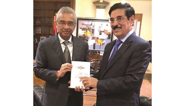 HE Dr Hamad bin Abdulaziz al-Kuwari presenting a book to Mauritius Prime Minister Pravind Jugnauth.