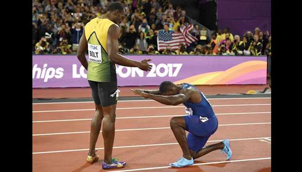 RESPECT: Justin Gatlin of the US bows to third placed Usain Bolt of Jamaica after winning the 100m sprint at the World Championships yesterday. It was the first ever defeat for Bolt in a major event.
