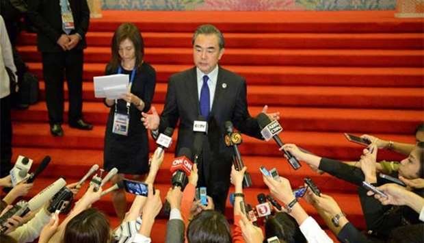 China's Foreign Minister Wang Yi speaks during a press conference on the sidelines of the 50th Association of Southeast Asian Nations regional security forum in Manila on Sunday.