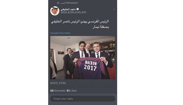 French President Emmanuel Macron congratulates PSG president Nasser al-Khelaifi on the signing of Neymar.