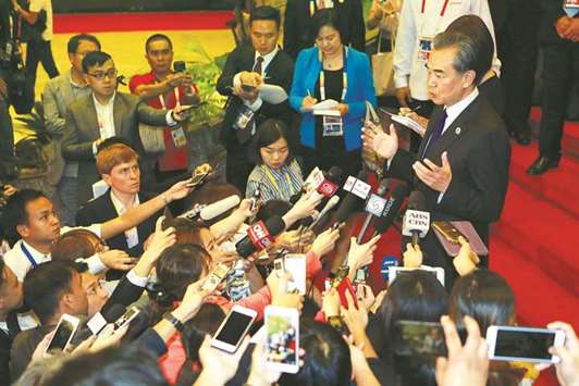 Chinese Foreign Minister Wang Yi is interviewed by the media.