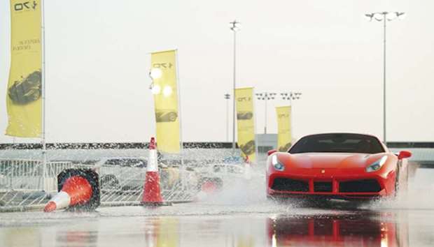The Ferrari 488 Spider tackling the specially prepared obstacle course at the Losail International Circuit.