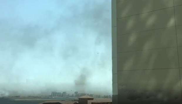 Smoke billowing after the fire broke out. Image grab from a video taken from the window of another hotel.