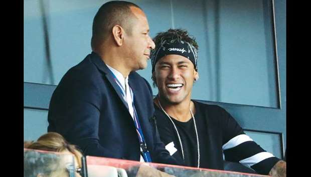 File picture of PSGu2019s Neymar (R) talking with his father, Neymar Snr.