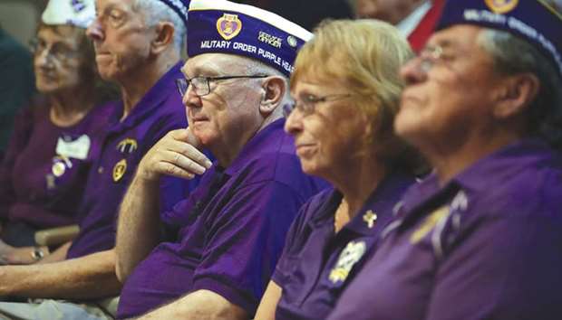 Purple Heart recipients from the Vietnam War and their spouses attend the National Purple Heart Day Ceremony at George Washingtonu2019s Mount Vernon in, Virginia. General George Washington established a badge of merit that became the Purple Heart Medal on August 7, 1782.