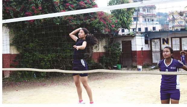 Female students practise volleyball at New Diamond Academy high school in Kathmandu. Long in the shadow of football and cricket, the sport is now already enjoying more support since the government picked it as the nationu2019s official sport.