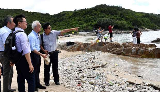 Under Secretary for the Environment Tse Chin-wan, visits a beach at Lamma Island on the progress of the cleaning up of palm oil by the govetnment, in Hong Kong,