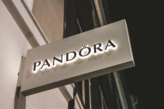 An illuminated logo is displayed outside a Pandora jewellery store in Copenhagen. Pandora is adding stores and rolling out new products in an effort to support US sales, which make up about one-quarter of the companyu2019s total revenue.