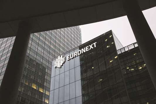 The Euronext logo is seen on the companyu2019s offices in Paris. The Pan-European exchange has extended its contract with Britainu2019s LCH in a surprise move that could help defuse tension over where euro-denominated trades are cleared after Brexit.