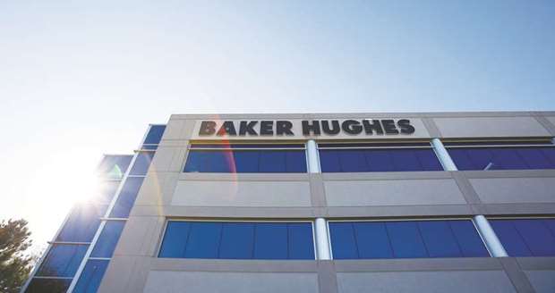 Baker Hughes signage is displayed at one of the companyu2019s facilities in Houston. Baker Hughes has won a major contract to provide a wide range of services to develop Papua New Guineau2019s first offshore gas field which is seen as a new model to help producers adapt to a world of low oil prices.