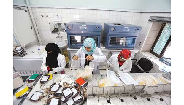 Employees register bags of blood at a blood transfusion centre in Sanaa.
