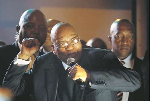 Zuma celebrates with his supporters after surviving the no-confidence motion in parliament.