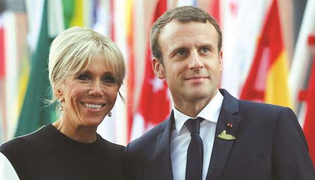 Macron and his wife Brigitte.