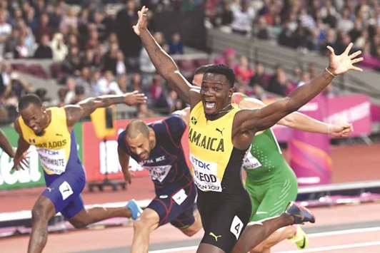 Jamaicau2019s Omar Mcleod (right) celebrates winning the menu2019s 110m hurdles final at the 2017 IAAF World Championships in London on Monday. (AFP)