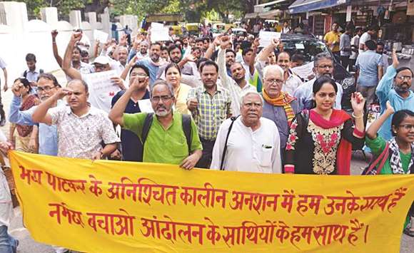 Social activists stage a demonstration after police forcibly removed Narmada Bachao Andolan campaigners in Dhar district in Madhya Pradesh, in New Delhi yesterday.