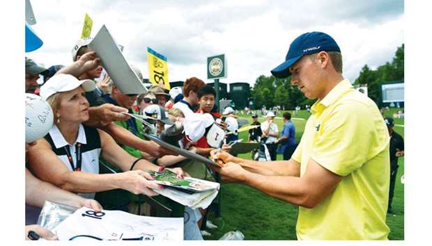 Jordan Spieth of the United States signs autographs during a practice round ahead of the PGA Championship at Quail Hollow Club in Charlotte, North Carolina. (AFP)