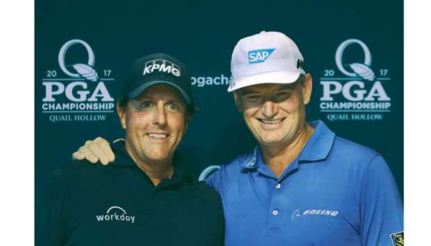 Phil Mickelson (left) of the United States and Ernie Els of South Africa ahead of their 100th major championship at Quail Hollow Club in Charlotte, North Carolina. (AFP)