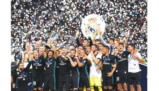 Real Madridu2019s players celebrate with the trophy after winning  the UEFA Super Cup final against Manchester United, at the Philip II Arena in Skopje.