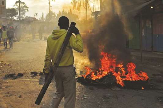 Protesters burn tyres in Kibera slum in Nairobi, a day after general elections. Kenyan police shot dead two protesters in the capitalu2019s flashpoint Mathare slum yesterday, as unrest broke out after opposition accusations that the general election was rigged, a senior officer told AFP.