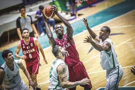 Qataru2019s Ali Saeed Efran attempts to score during a Group B game against Iraq at the  2017 FIBA Asia Cup in Beirut, Lebanon, yesterday.