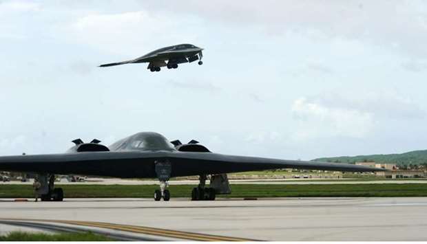 A B-2 Spirit bomber deployed from Whiteman Air Force Base, Missouri, takes off from the runway behind another B-2 at Andersen Air Force Base, Guam August 24, 2016