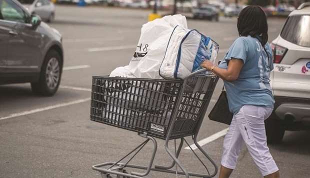 A customer pushes a shopping cart while exiting a Bed Bath & Beyond Inc store in Charlotte, North Carolina. The Labour Department said yesterday its Consumer Price Index advanced 0.2%, the bulk of which was due to a rise in the cost of shelter, driven by higher rents.