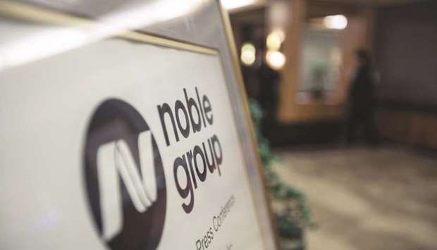 Noble Group signage is displayed during an investor day in Singapore (file). The embattled commodity trader yesterday set a shareholder meeting for the end of this month to approve its controversial $3.5bn debt-restructuring deal.