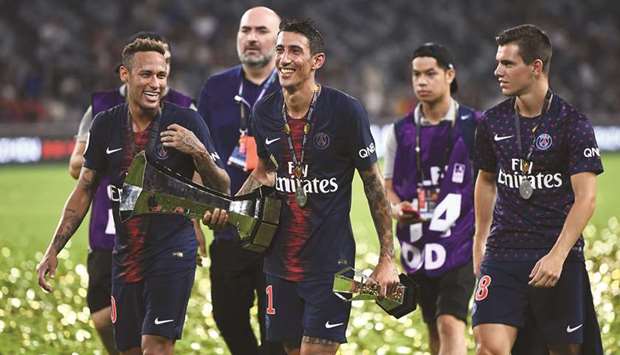 Paris Saint-Germainu2019s Neymar (let), Angel Di Maria (centre) celebrate after winning the French Trophy of Champions in Shenzhen, China, last week. (AFP)