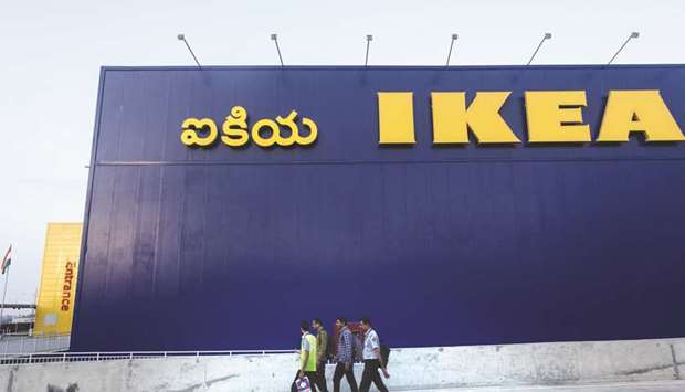 Employees arrive for work ahead of the opening of the Ikea store in Hitech City on the outskirts of Hyderabad, India, yesterday. While every branch of the worldu2019s largest furniture retailer has that most unmistakable whiff of flat-pack conformity, regional differences do exist.