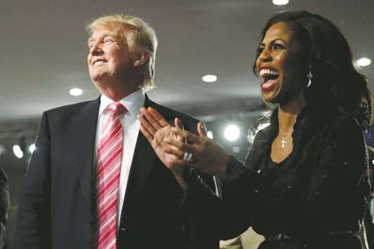 Republican presidential nominee Donald Trump and Omarosa Manigault (right) attend a church service, in Detroit, Michigan, in a file photo.