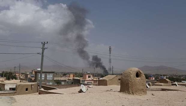 Smoke rising into the air after Taliban militants launched an attack on the Afghan provincial capital of Ghazni.