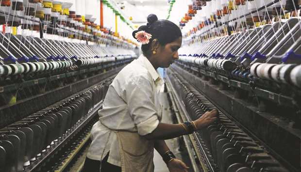 A woman works at a textile mill in Mumbai. Indiau2019s total textile imports jumped by 16% to a record $7bn in the fiscal year to March 2018. Of this, about $3bn were from China.
