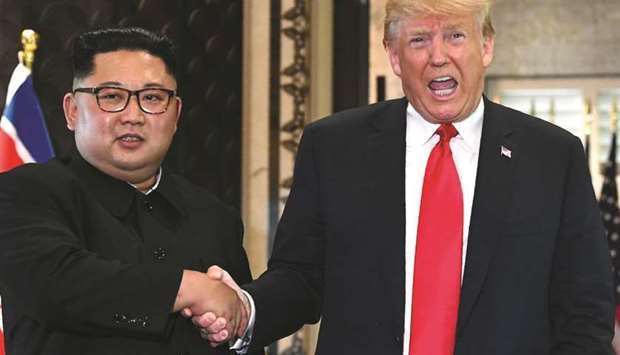 Kim Jong-un meeting Donald Trump during their historic summit in Singapore on June 12, 2018.