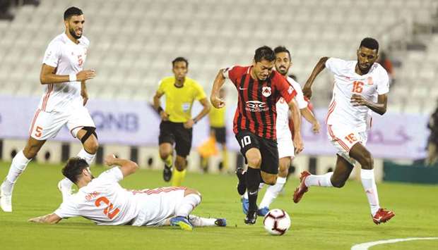 Al Rayyan captain Rodrigo Tabata dribbles his way past the Umm Salal defence yesterday.